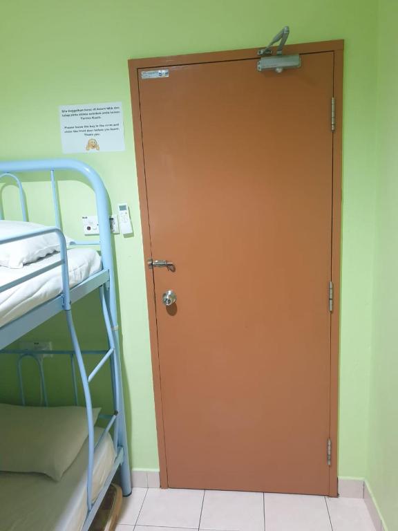Postel nebo postele na pokoji v ubytování Borneo Gaya Lodge