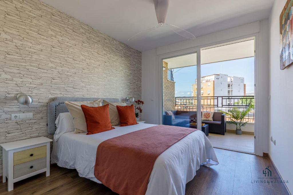Posteľ alebo postele v izbe v ubytovaní Living4Malaga Theatre Square Terrace