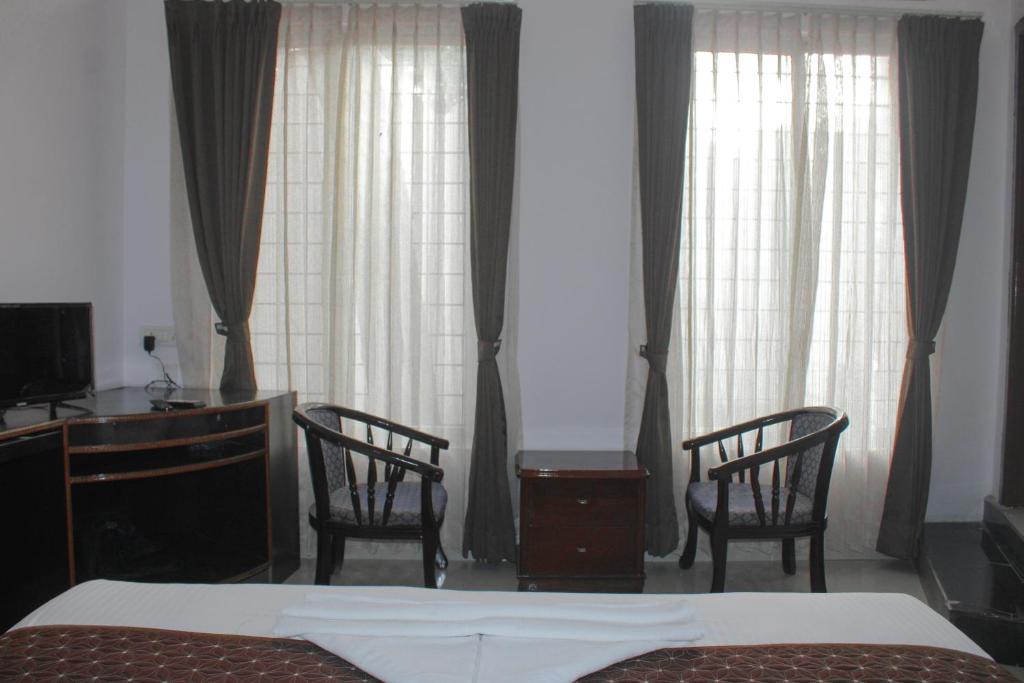 Postel nebo postele na pokoji v ubytování Advaitha Serenity Resorts