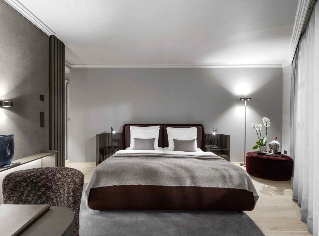 Postel nebo postele na pokoji v ubytování Hotel Weisses Roessl