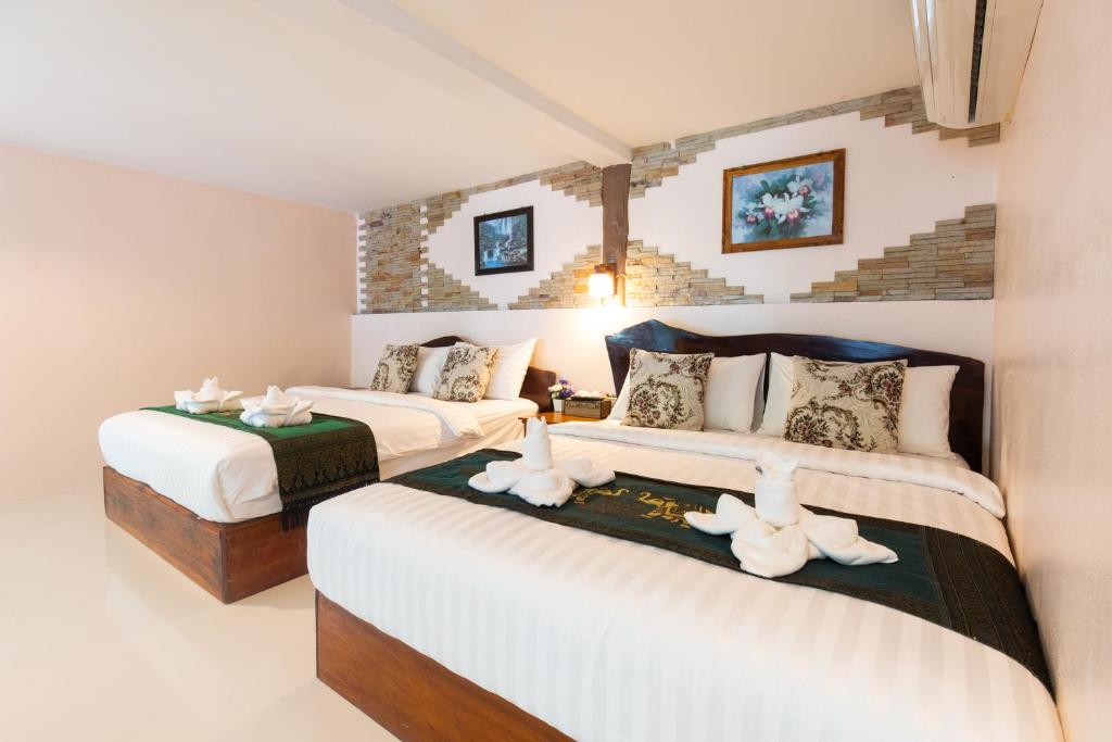 Postel nebo postele na pokoji v ubytování Naiyang Discovery Beach Resort SHA