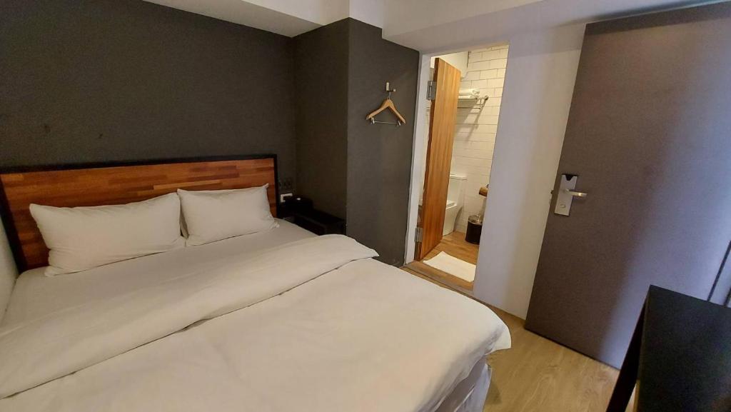 Postel nebo postele na pokoji v ubytování Daan Park Hotel