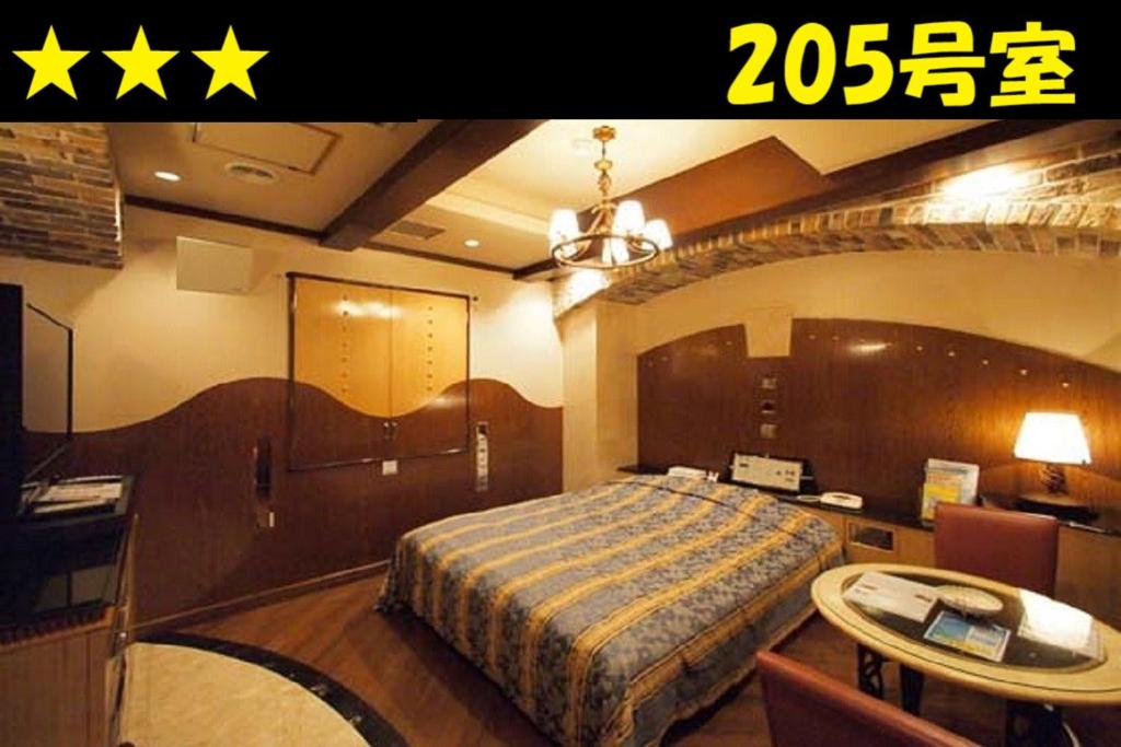 Postel nebo postele na pokoji v ubytování HOTEL Us Bentenbashi Adult only