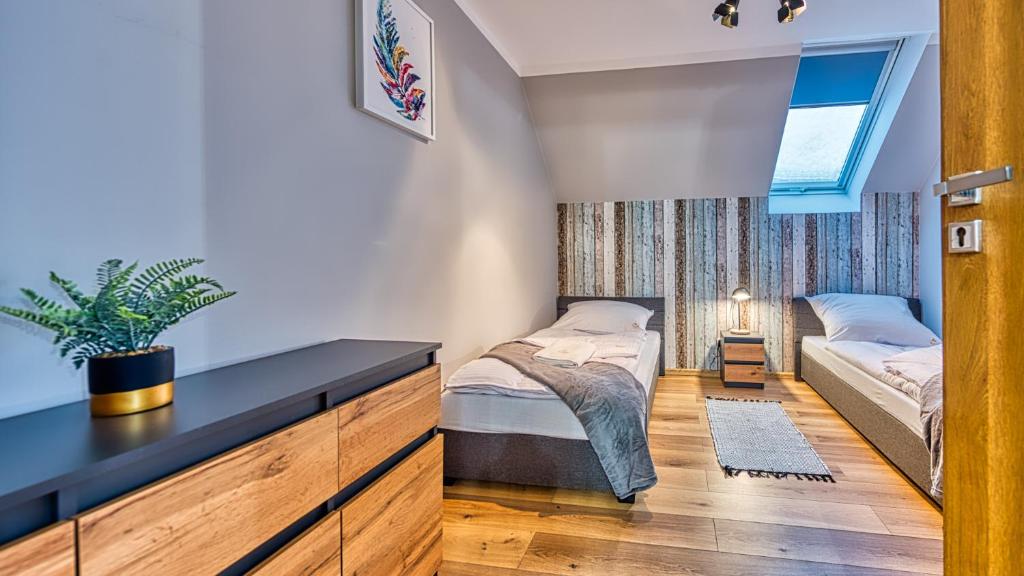 Posteľ alebo postele v izbe v ubytovaní Apartament Cicha 5 VIP z SAUNĄ by Royal Aparts