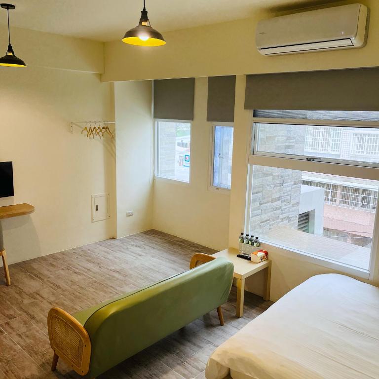 Postel nebo postele na pokoji v ubytování 古栗Chestnut Guest House-可包棟民宿