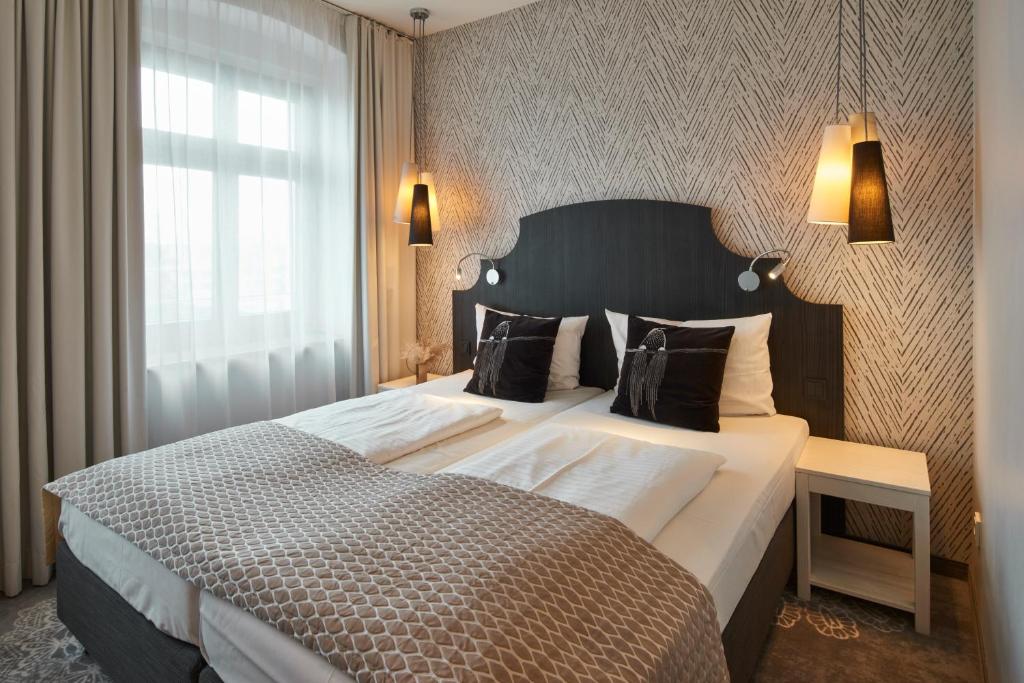 Letto o letti in una camera di Hotel Via Regia - VIAs-Hotels