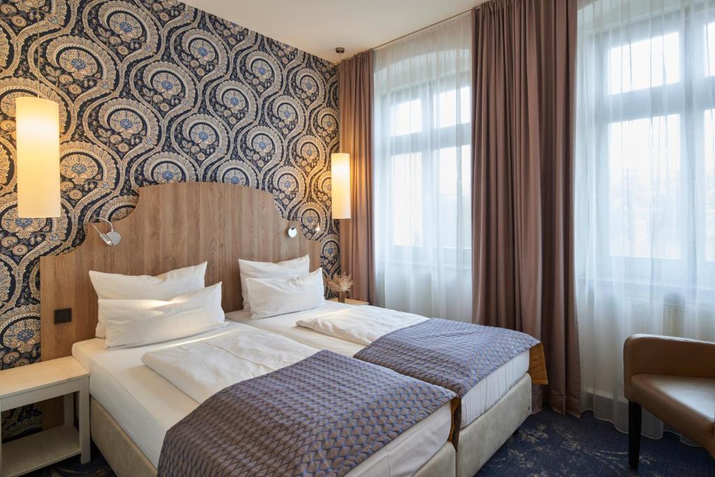 Letto o letti in una camera di Hotel Via Regia - VIAs-Hotels