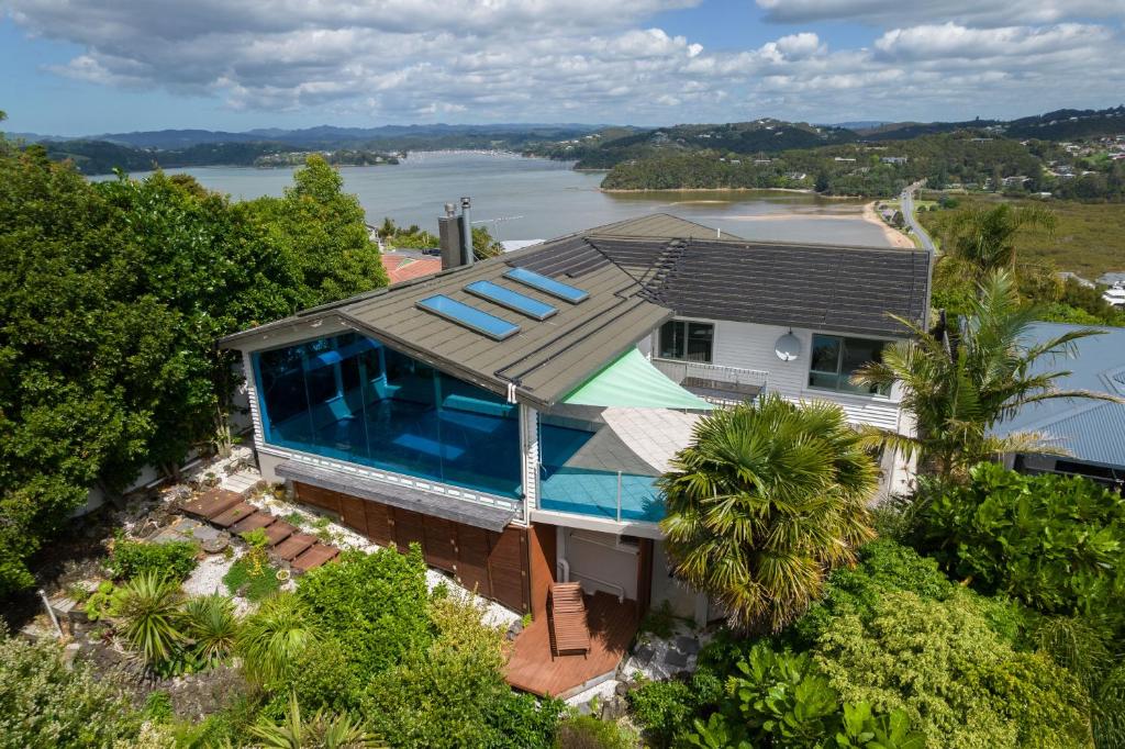 an aerial view of a house with a swimming pool at Swallows Nest - Paihia Holiday Home in Paihia