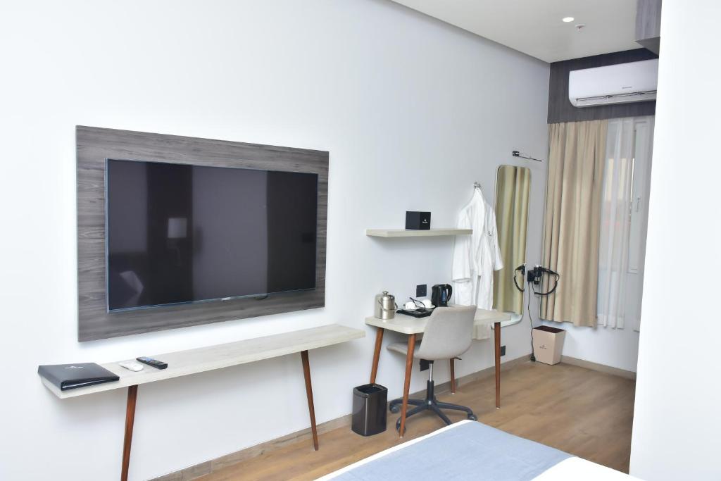 TV a/nebo společenská místnost v ubytování Hotel Stella
