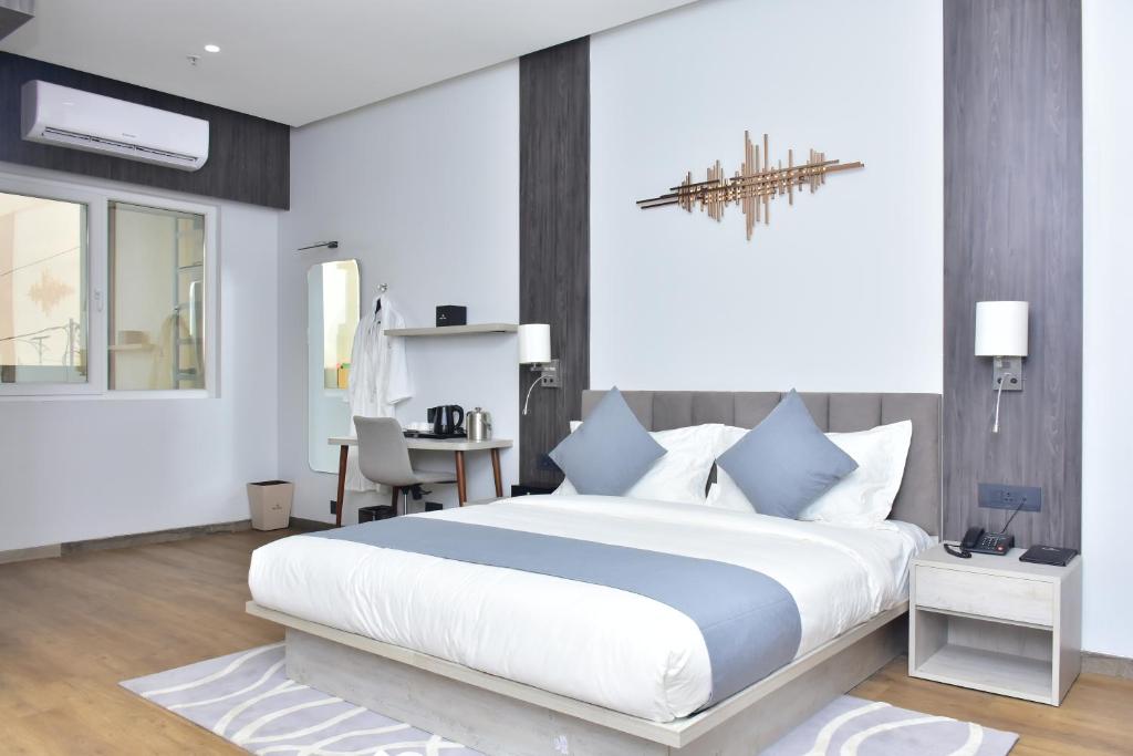 Postel nebo postele na pokoji v ubytování Hotel Stella