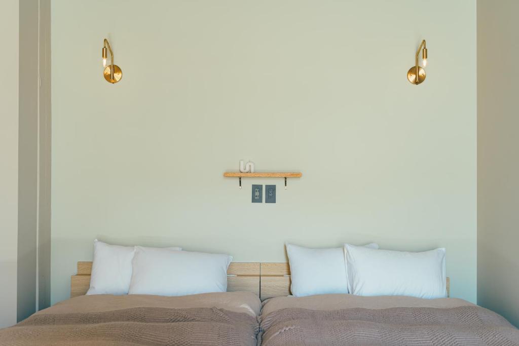 Postel nebo postele na pokoji v ubytování Kiten - slow & work stay -