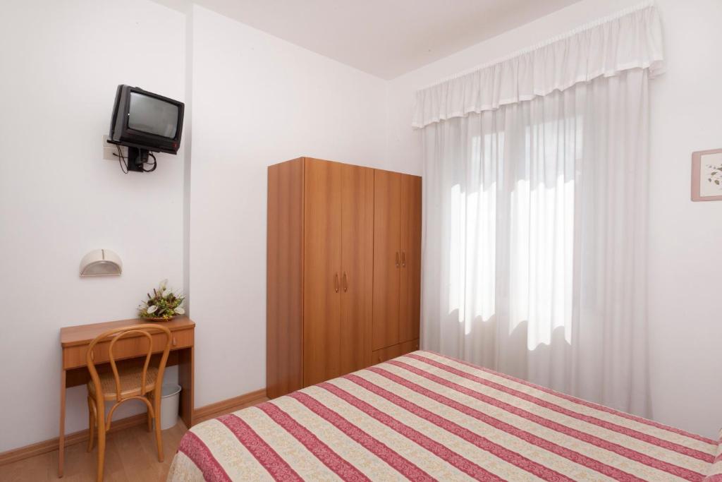 TV a/nebo společenská místnost v ubytování Hotel Perugina