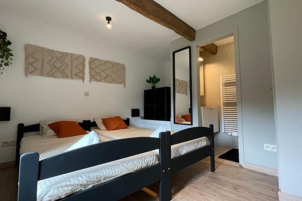 Ein Bett oder Betten in einem Zimmer der Unterkunft Le Belle-Vue