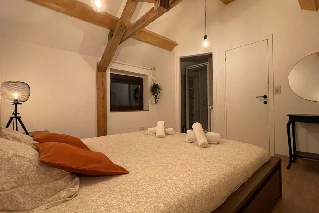 Ein Bett oder Betten in einem Zimmer der Unterkunft Le Belle-Vue