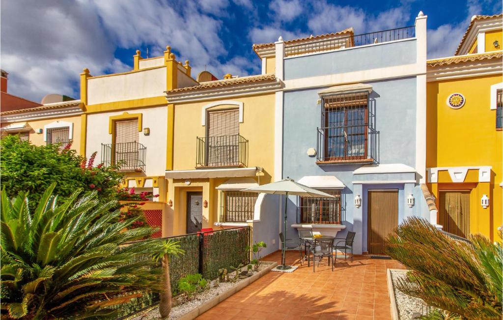 a house with a patio in front of it at Amazing Home In Roda With Wifi in Roda