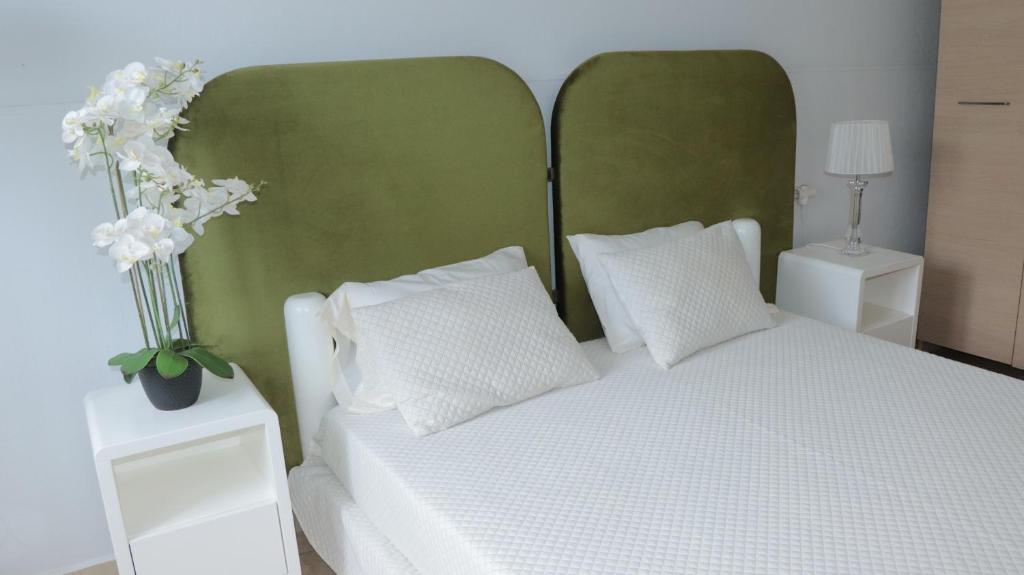 Postel nebo postele na pokoji v ubytování Apartamento Moradias Djadsal C01 próximo à Praia de Santa Maria