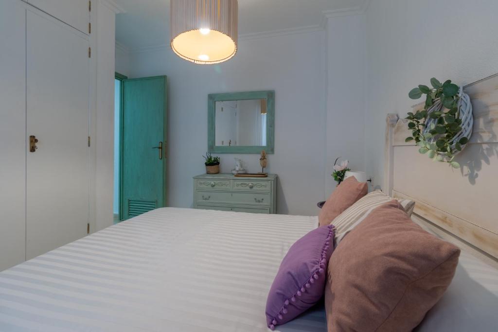 Posteľ alebo postele v izbe v ubytovaní Apartamento Céntrico Isaura