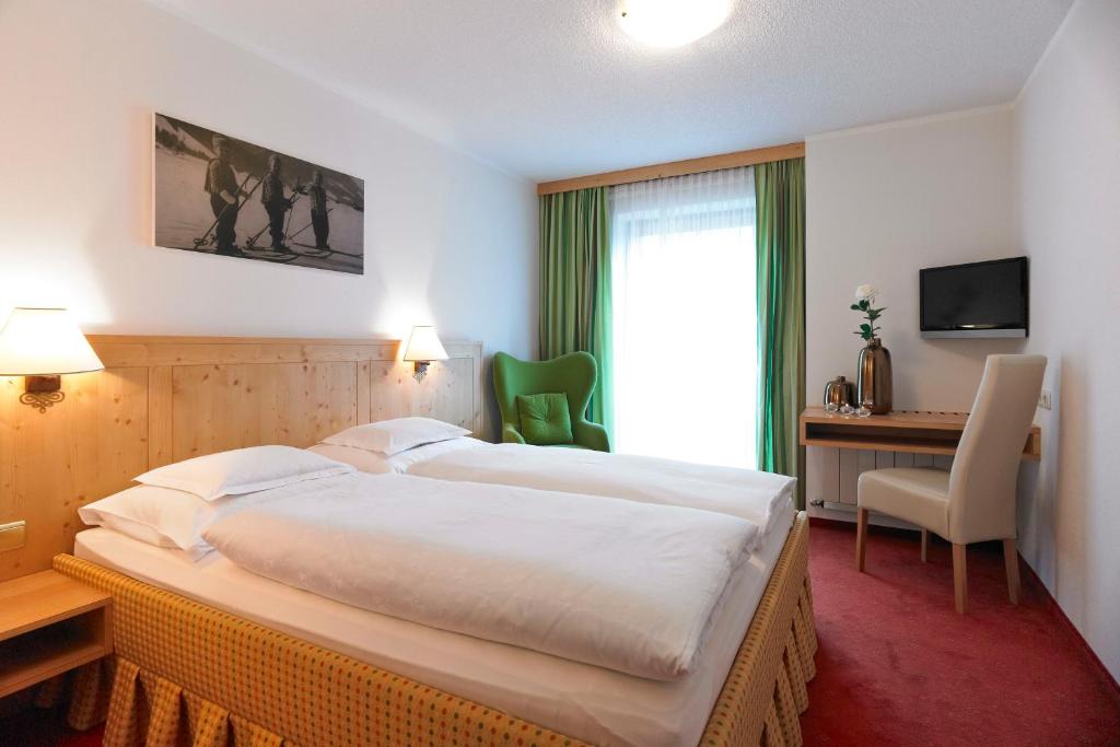 Postel nebo postele na pokoji v ubytování Hotel Bianca