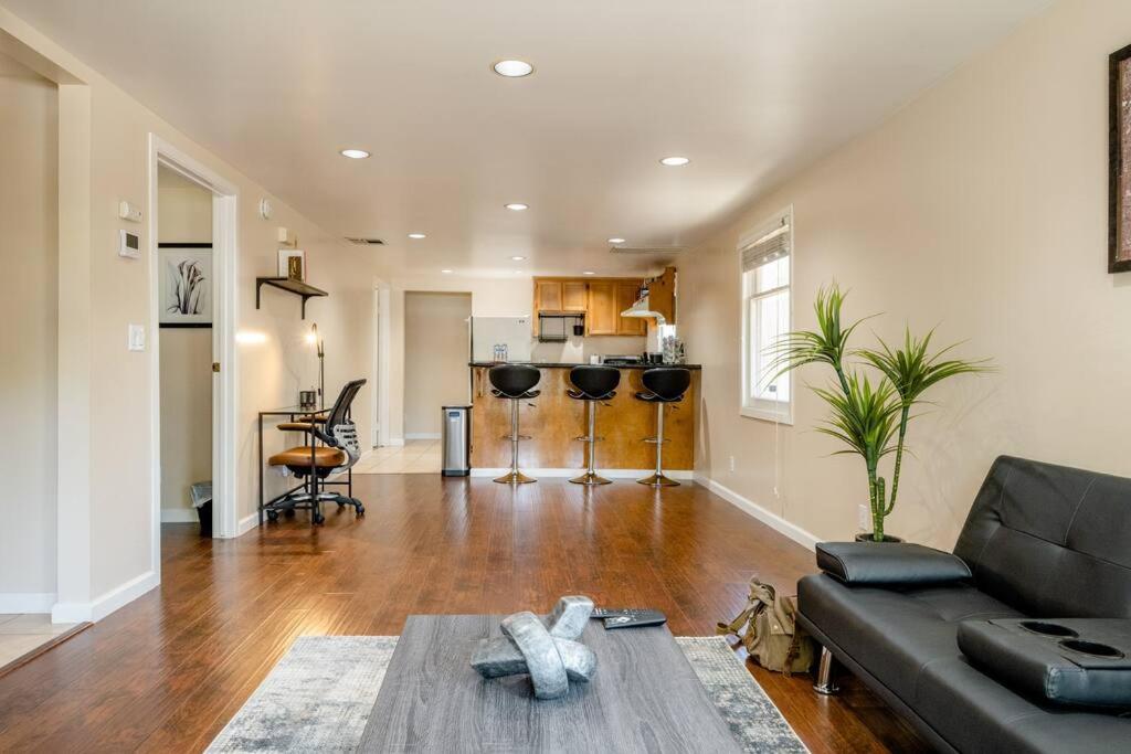 a living room with a couch and a table at *2bdr Victorian Home away from Home - *Central Loc in Sacramento