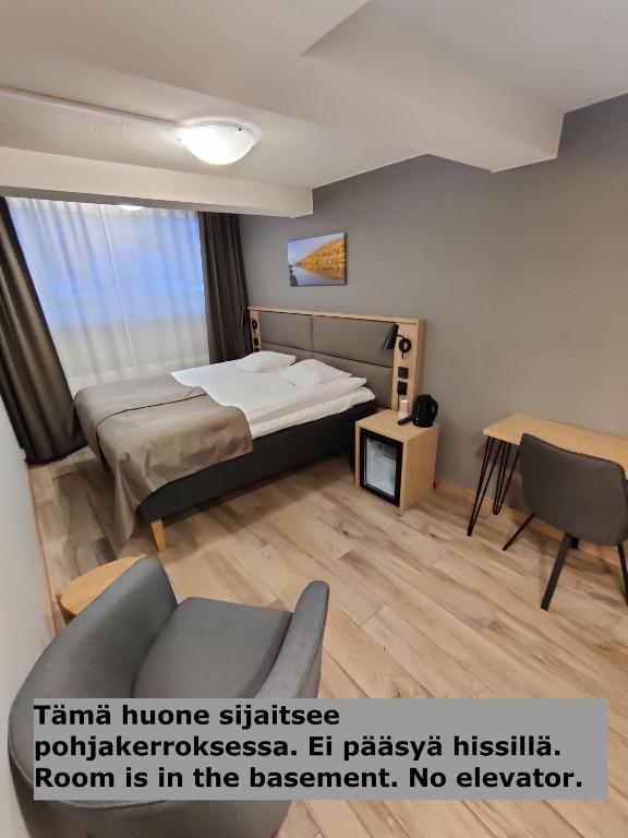 Postel nebo postele na pokoji v ubytování Hotelli Toivola