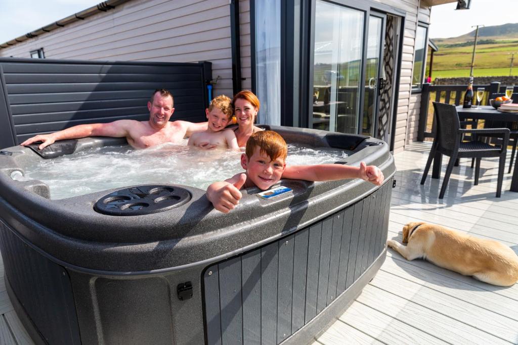 a group of people in a hot tub at Machrihanish Holiday Park in Campbeltown