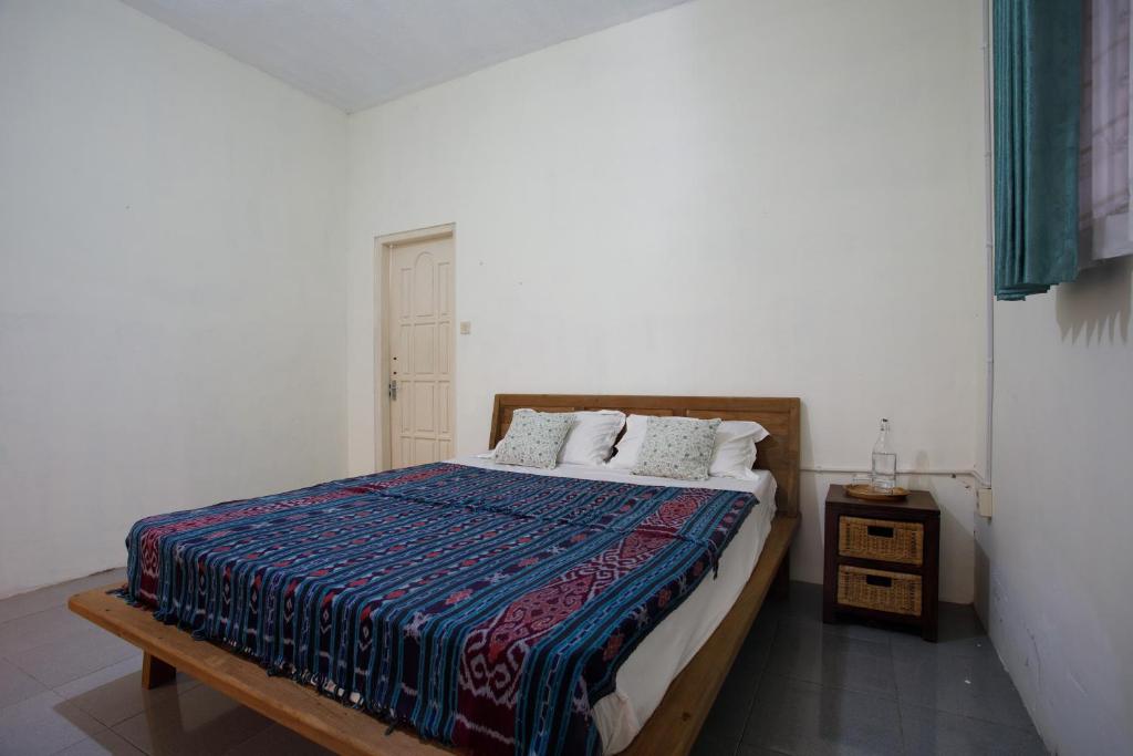 Postel nebo postele na pokoji v ubytování Rumah Kalpataru