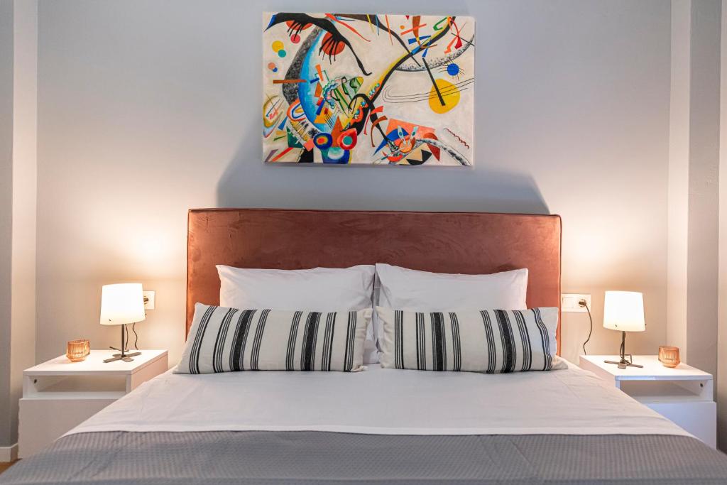 A bed or beds in a room at Athenian center apartments