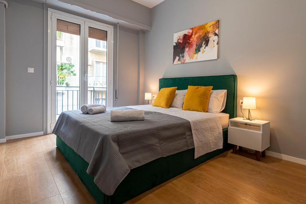 A bed or beds in a room at Athenian center apartments
