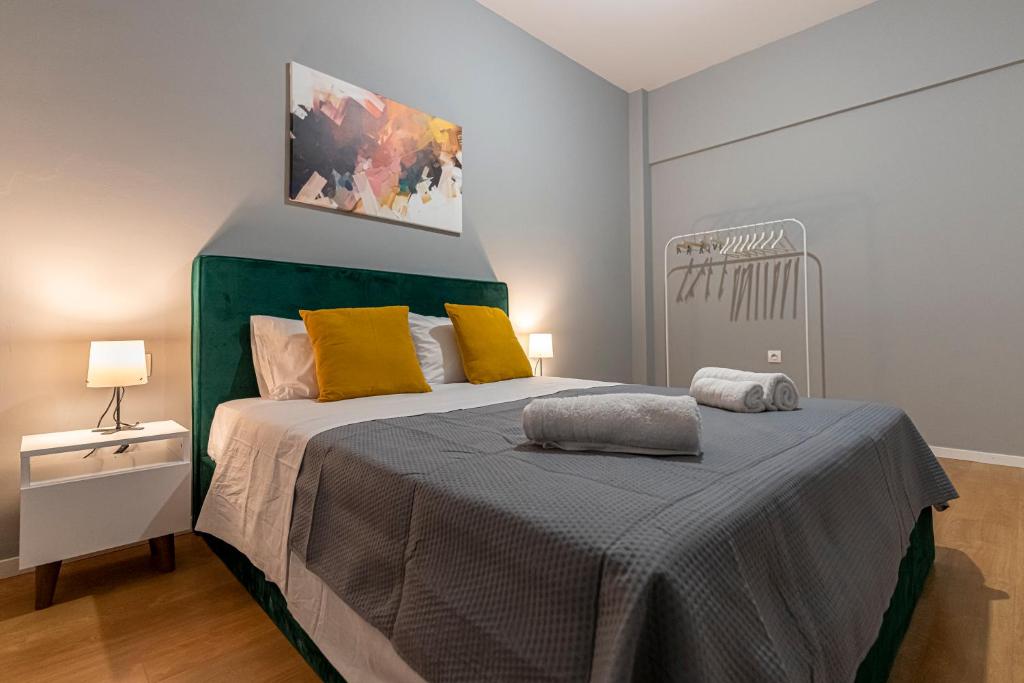 A bed or beds in a room at Athenian center apartments