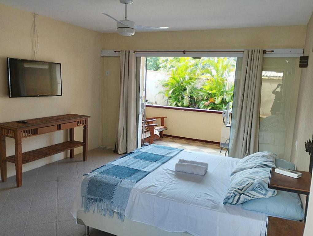 מיטה או מיטות בחדר ב-Andorinhas Suites