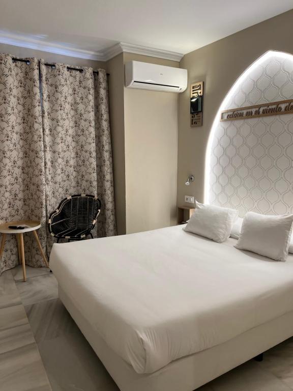 Posteľ alebo postele v izbe v ubytovaní Alameda Hostal Boutique