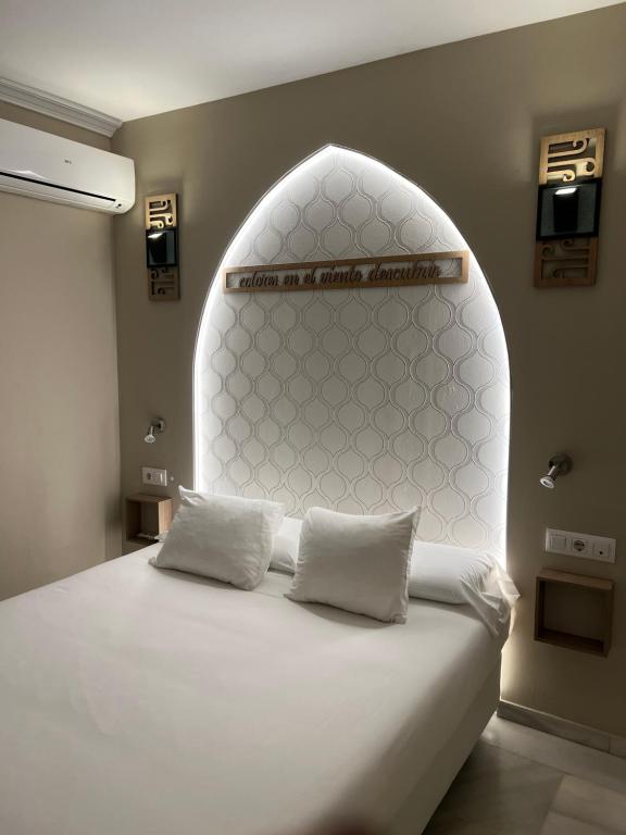 Posteľ alebo postele v izbe v ubytovaní Alameda Hostal Boutique