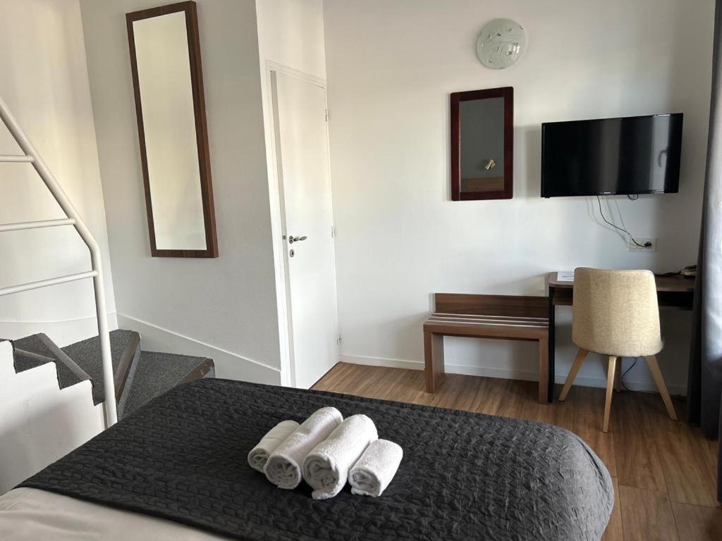 Postel nebo postele na pokoji v ubytování Hotel Moderne