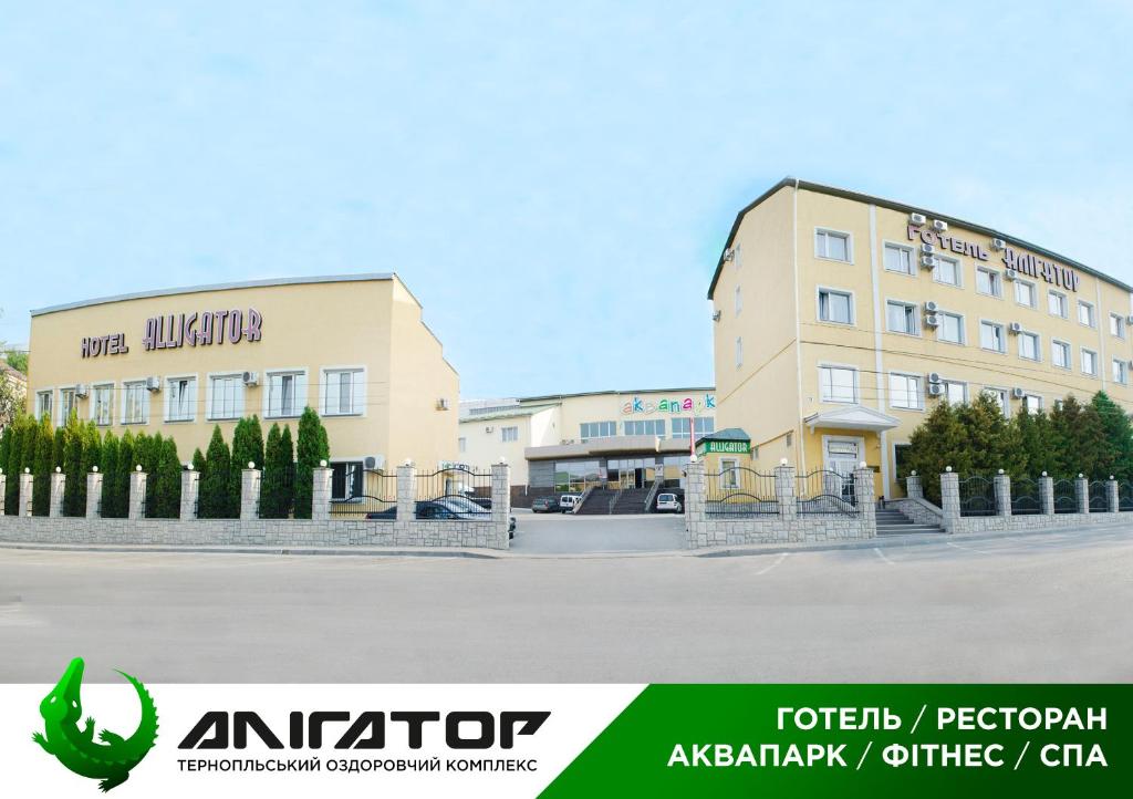 a building with a cactus in front of it at Hotel Aquapark Alligator in Ternopil