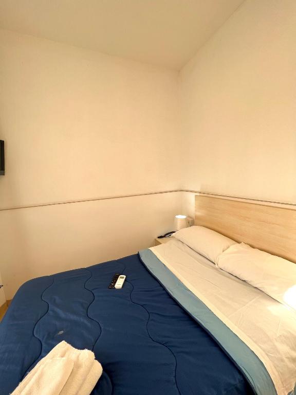 Postel nebo postele na pokoji v ubytování Hotel Como