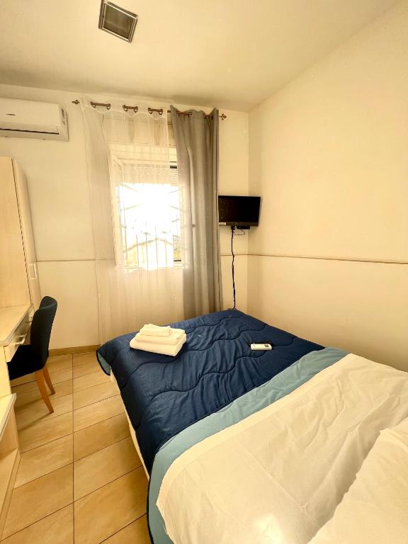 Postel nebo postele na pokoji v ubytování Hotel Como