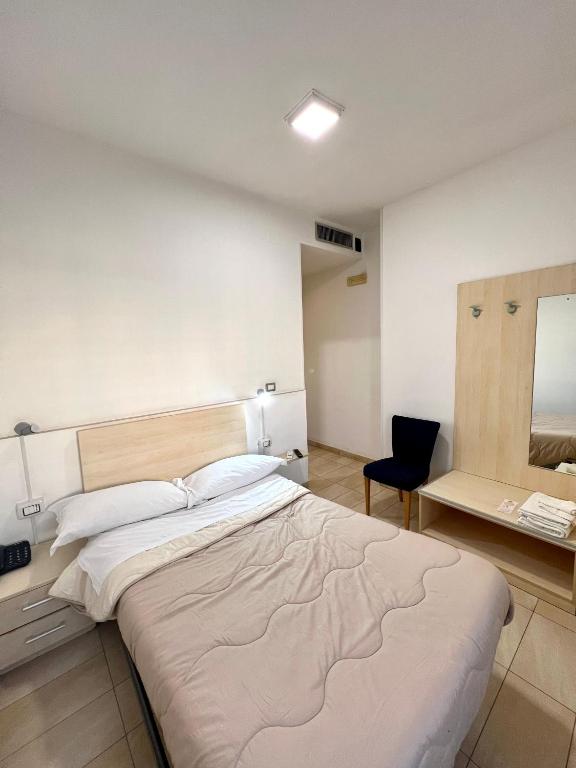 Postel nebo postele na pokoji v ubytování Hotel Como