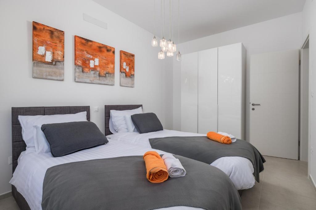 Posteľ alebo postele v izbe v ubytovaní Villa Mare & Skye