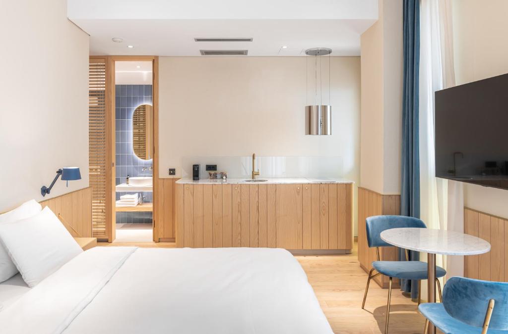 TV a/nebo společenská místnost v ubytování Rosetti Hotel