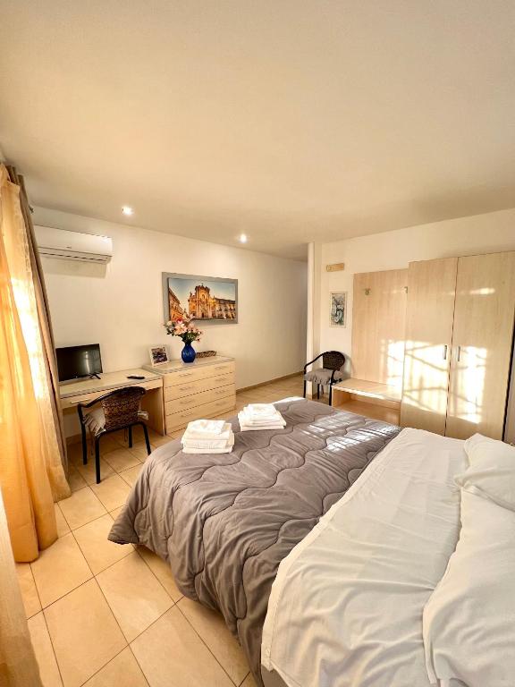 Postel nebo postele na pokoji v ubytování Hotel Como
