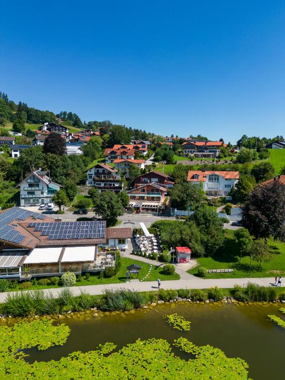 an aerial view of a small town with a pond at Hotel San Marco in Füssen
