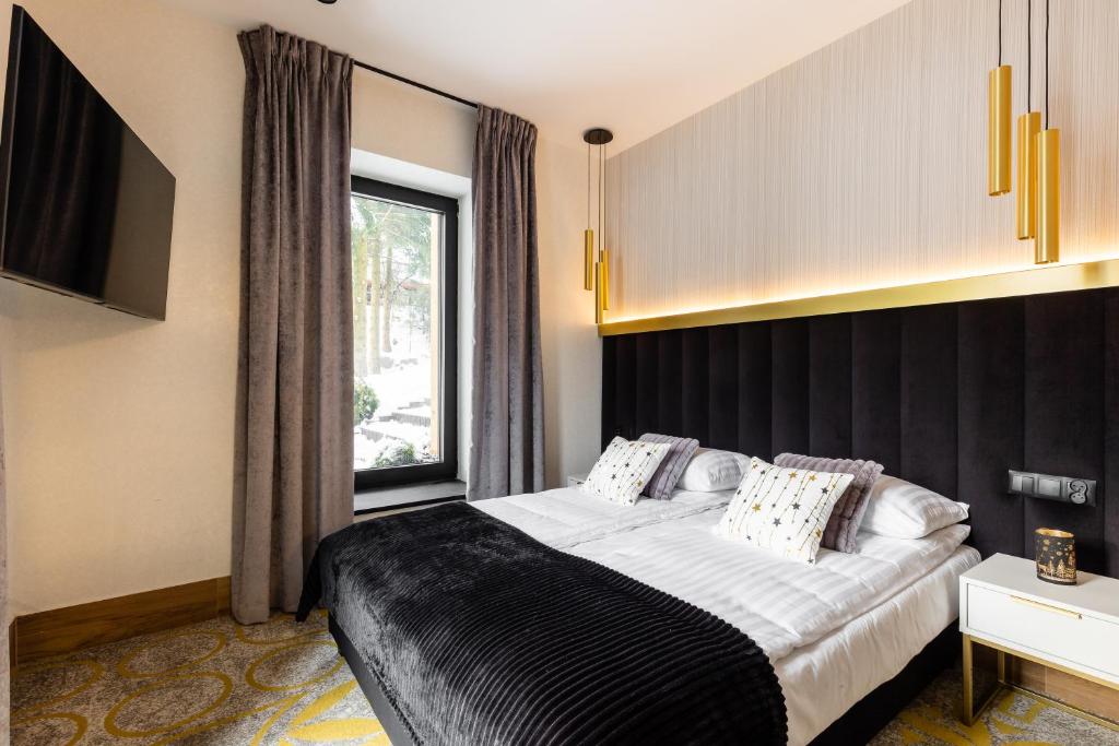Posteľ alebo postele v izbe v ubytovaní Tatry Residence SPA