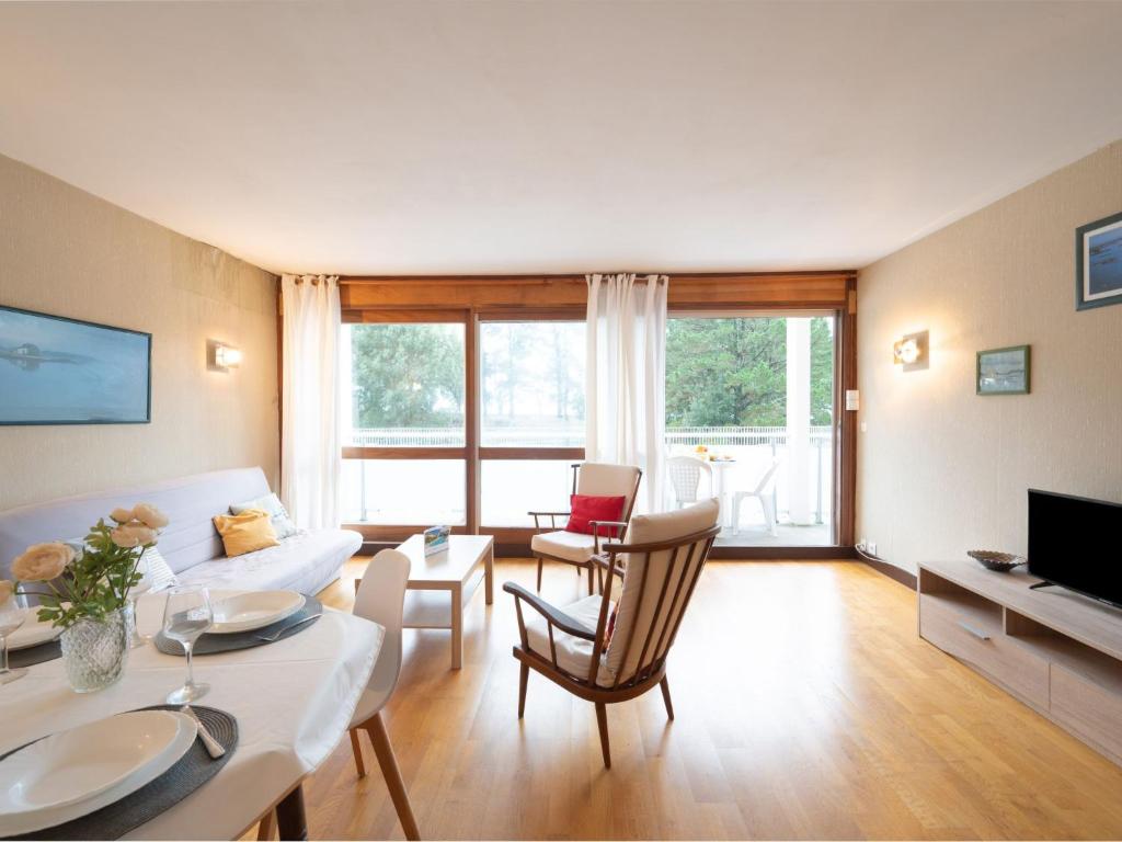 a living room with a couch and a table at Apartment Men Er Bellec-1 by Interhome in Saint-Philibert