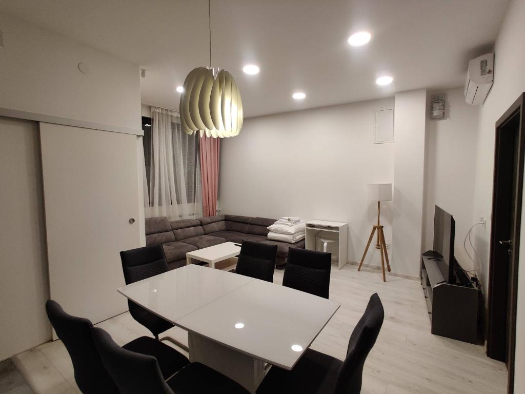 a living room with a white table and chairs at APARTMENT Dominik **** in Zagreb