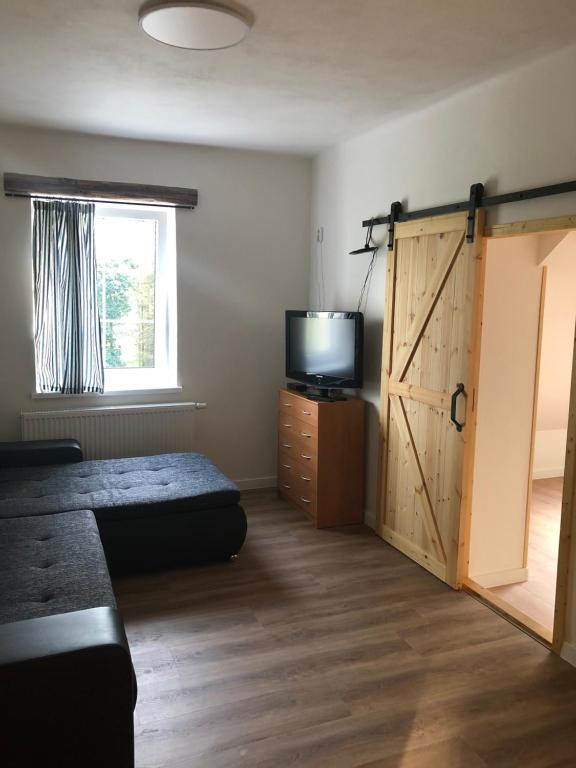 Postel nebo postele na pokoji v ubytování Apartmány Razová - Slezská Harta