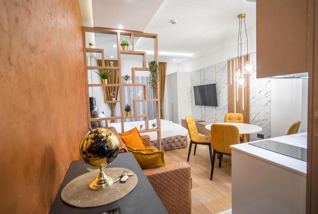 a room with a kitchen and a living room at PLEASURE LUX GOLD in Kopaonik