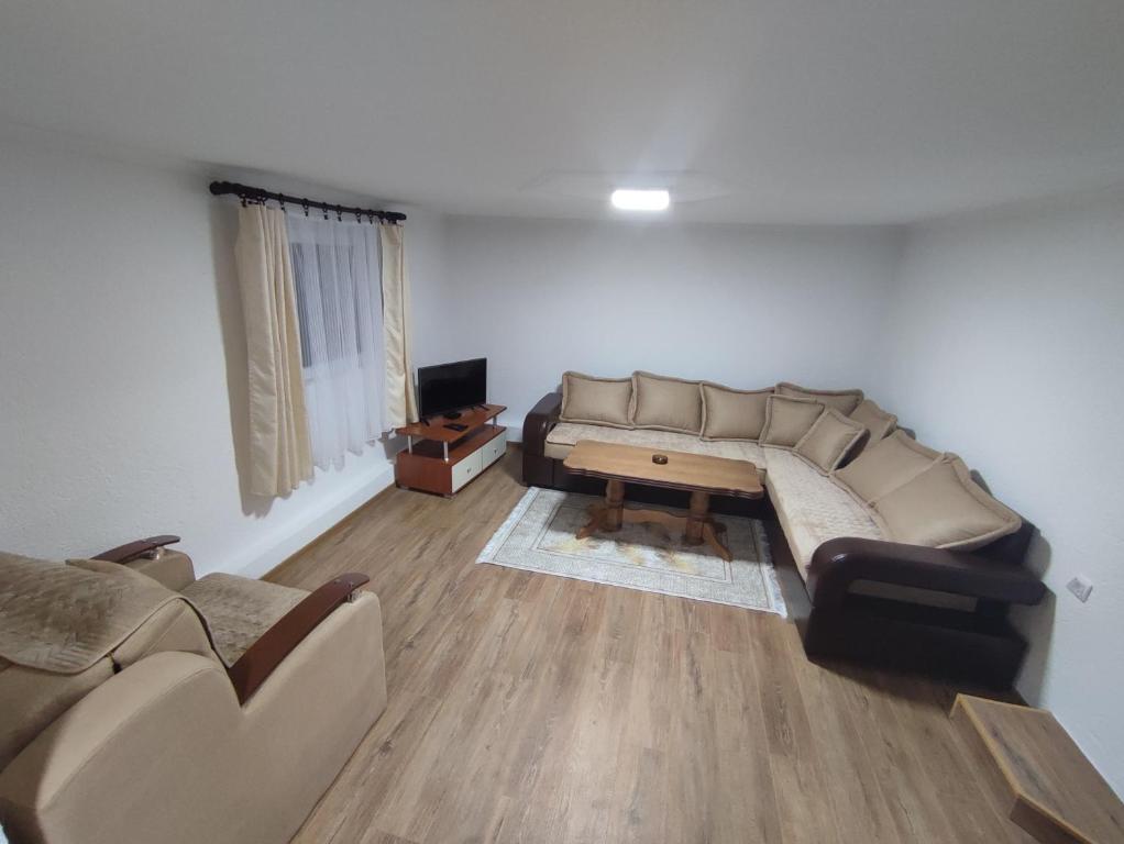 a living room with a couch and a table at Apartman Jakša in Žabljak