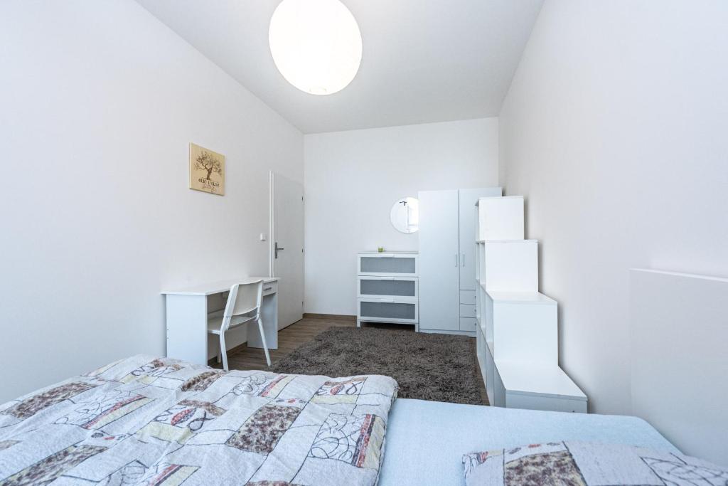 Postel nebo postele na pokoji v ubytování Apartment Americká 8