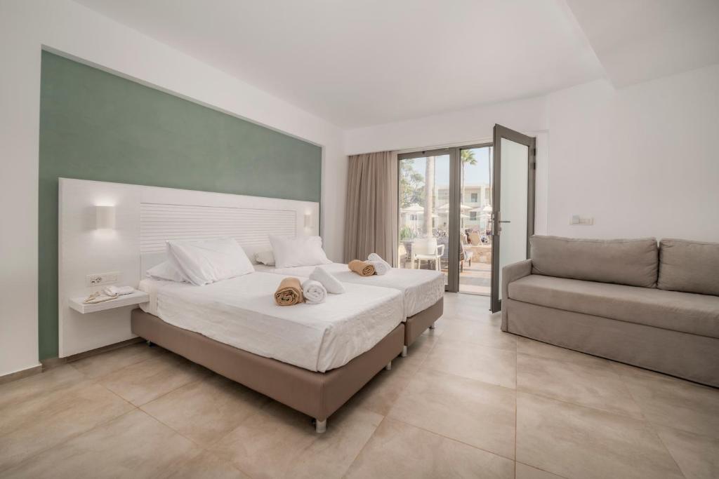 Postel nebo postele na pokoji v ubytování Apollon Hotel