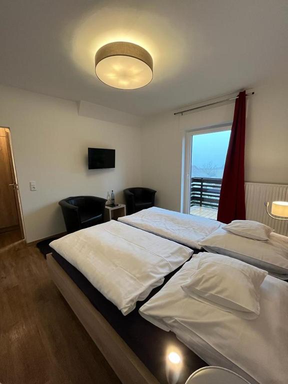 Postel nebo postele na pokoji v ubytování Hotel Clemens